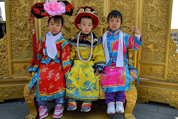 Little Emperor and Emperesses in traditional dress
