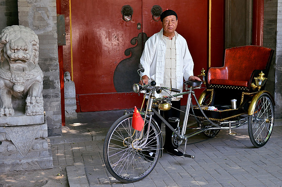Mr Bai and his traditional hand built rickshaw
